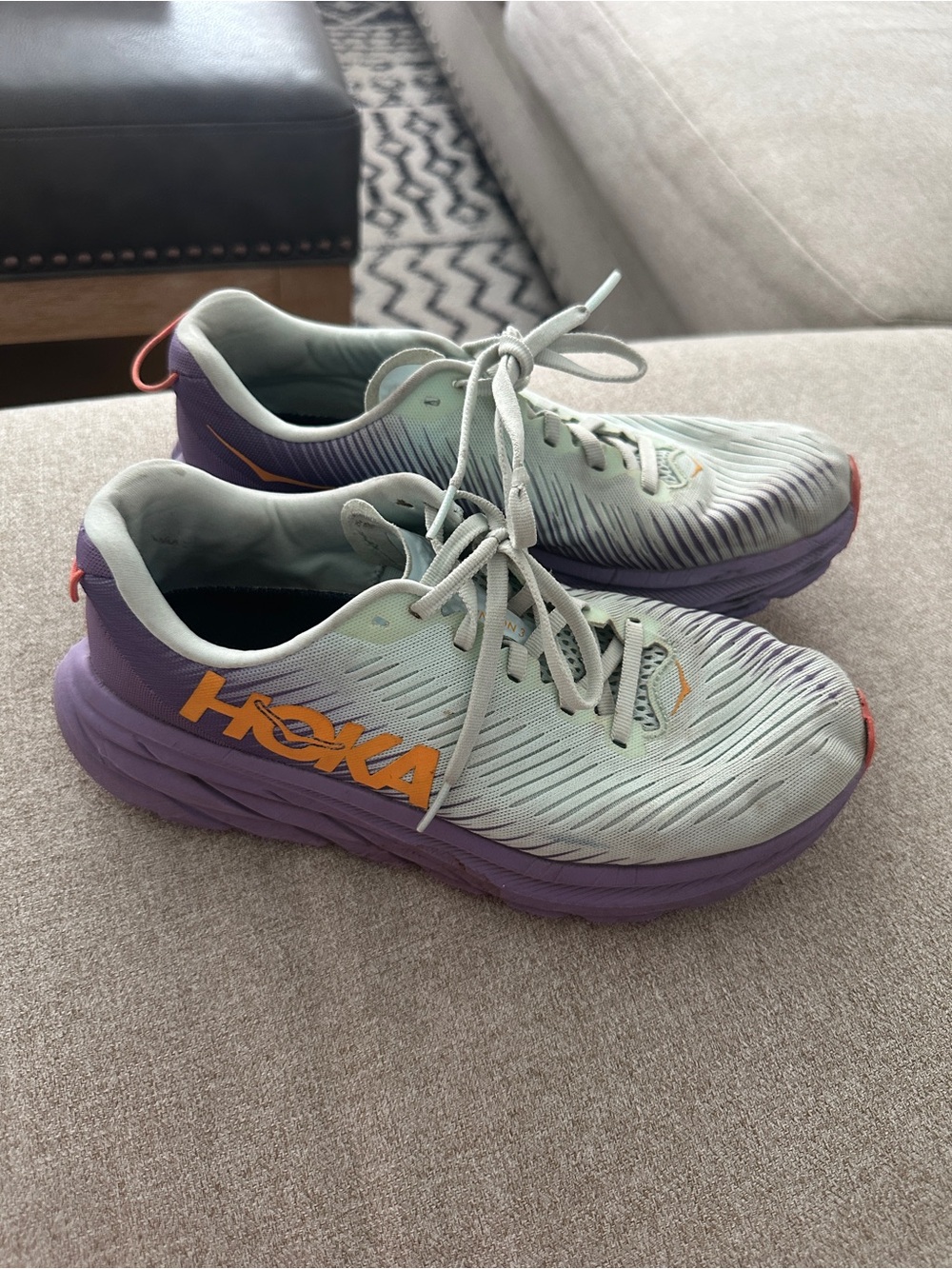 Used and well worn women’s Hoka running sneakers, size 7.5
